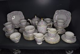 A part tea service by Mintons in the Petunia design service in good condition