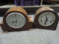 Four vintage wood cased mantel clocks.
