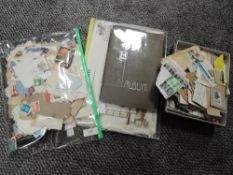 A selection of collectable world wide stamps some loose some in an album