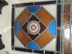 Four antique leaded light glass panels.