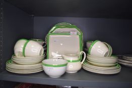 A part tea service in an art deco green colourway