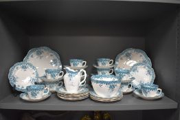 A late Victorian part tea service in a blue floral print