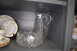 A clear cut crystal glass bowl and similar water jug