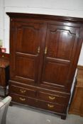 A period oak linen press having double cupboard over drawer base, on bracket feet, width approx.