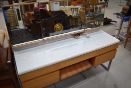 A vintage laminate topped dressing table drawer set