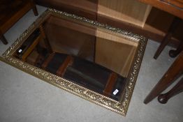 A modern gilt frame wall mirror
