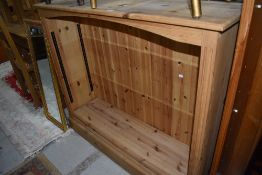 A modern pine bookshelf, w 122cm