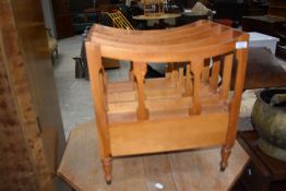 A modern satin wood Canterbury magazine storage rack