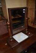 A 19th century mahogany frame toilet swing mirror, having square marble inset