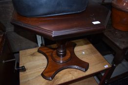 A modern stained frame occasional table having octagonal top and cross base