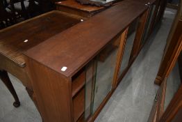 Three vintage sapele bookcases , one narrow, two wide, all with sliding glass doors