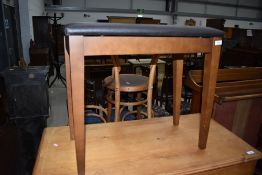 A late 20th century organ stool