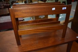 A mid century teak magazine rack