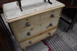 A stripped pine chest of two over two drawers