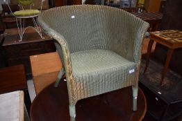 A Green Lloyd Loom tub chair