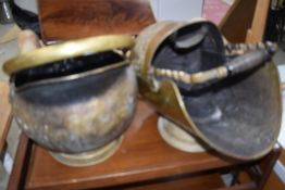 Two coal scuttles or buckets including helmet style