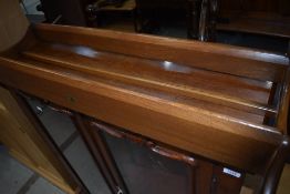 An Ercol mid elm wall Delft rack, w 38cm