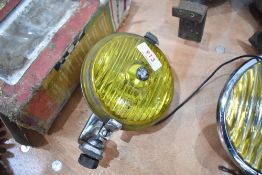 A Wipac yellow tinted spotlight