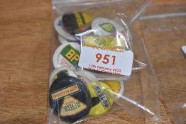 A selection of petrol advertising badges