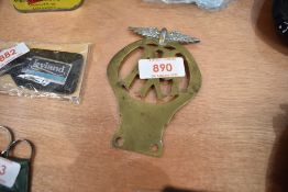 A brass AA vehicle radiator badge