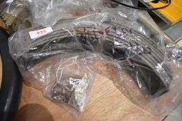 A complete set of brake shoes and rivits for a 1938 Wolseley 14/60