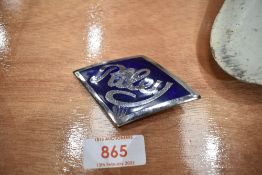 A motor car enamel badge for Riley