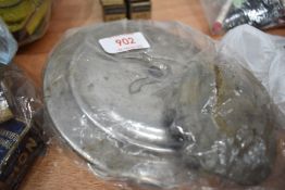 A selection of car hubcaps and badges