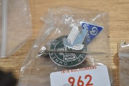 A selection of motor car badges including Renault, Daimler and Triumph