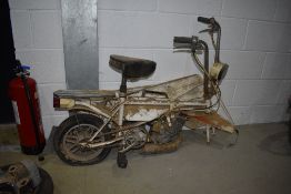 A Mobylette Motobecane X1 folding Moped circa 1970's. With missing wheel, includes spare engine