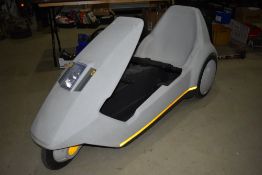 A Sinclair C5 no battery. The Sinclair C5 is a one-person battery electric recumbent tricycle. It