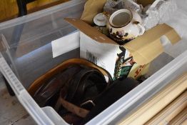 A selection of leather belts and a Japanese tea set