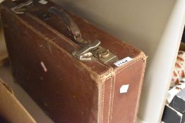 A vintage leather bound suitcase