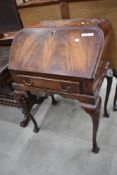 A reproduction bureau on stand, walnut, cabriole legs