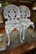 Two cast aluminium garden chairs