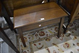 An early 20th Century dark oak low side table