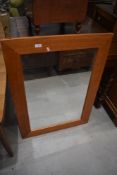 A modern pine wall mirror, approx. 92 x 67cm