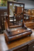 A 19th Century mahogany toilet mirror having drawer base