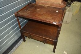 An early 20th Century oak tea trolley of large proportions with drawer to lower tier, dimensions