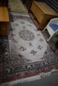 A traditional oriental style carpet square/rug, approx. 230 x 170cm (excluding tassles)