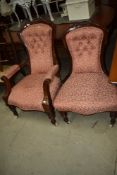 A pair of Victorian mahogany easy chair (one with arms) having later upholstery