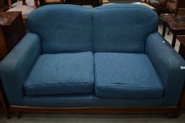 An Edwardian two seater settee upholstered in blue tweed style fabric