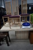 A polished concrete dining table and set of four beech effect high back dining chairs, table
