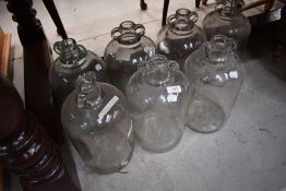 A selection of glass demijohns