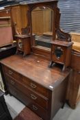 A Victorian mahogany dressing table having mirror back and jewellery compartments with two over