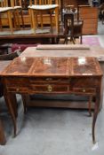 A Loius XIV style dressing/sewing/work table having lift top compartments to each side and mirror to