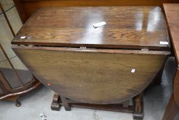 A vintage oak gateleg dining table