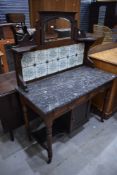 A Victorian washstand having mirror and tile back and marble top on turned frame, width approx.