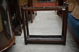 An early 20th Century oak stick/umbrella stand, includes drip tray