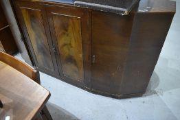 An early to mid 20th Century sapele sideboard having stepped design, with central double cupboard