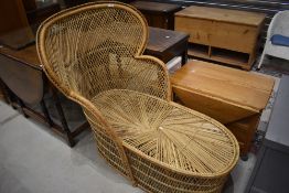 A vintage wicker day bed/lounger